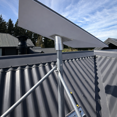 Spacetek heavy duty Starlink Gen 3 roof mount kit installed on black corrugated tin roof with tripod support