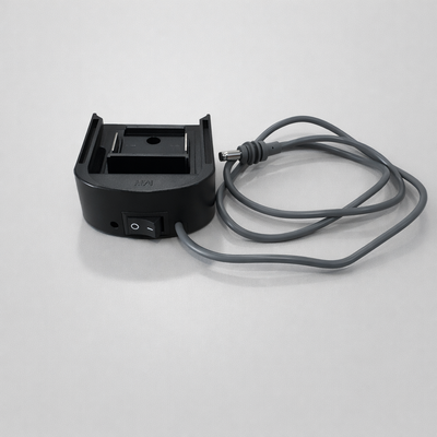 Spacetek Makita battery adaptor for Starlink Mini displayed with separate DC cable and barrel plug connector on light grey background