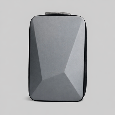 Front view of Spacetek hardshell backpack in matte grey with geometric panel design, ideal for tech travel and minimalist urban style